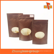 Tamaño personalizado kraft frutos secos bolsa de papel con ventana ovalada y cremallera fabricante
